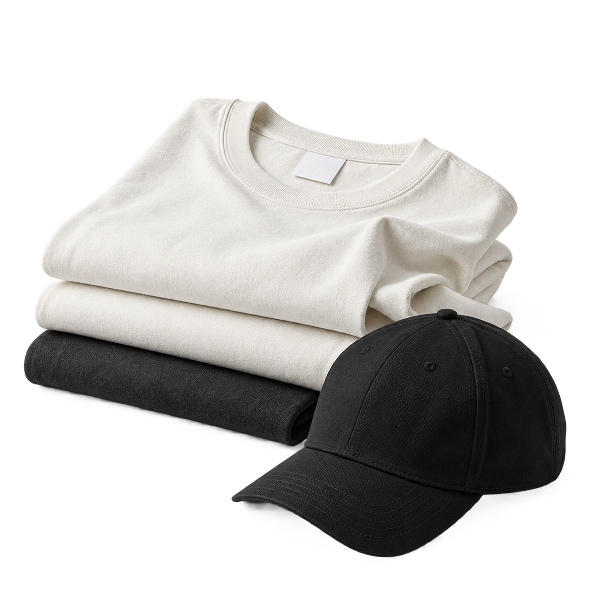 Isolated folded bone and charcoal blank shirts with a black cap, ready for custom decoration